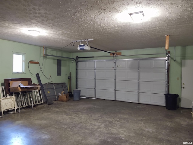 garage featuring electric panel and a garage door opener