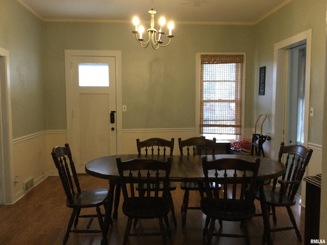 dining area with plenty of natural light, crown molding, and dark wood-type flooring