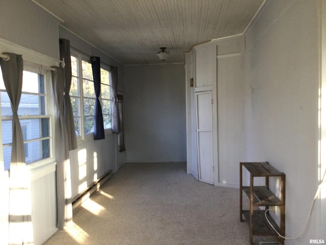 sunroom / solarium featuring a baseboard heating unit