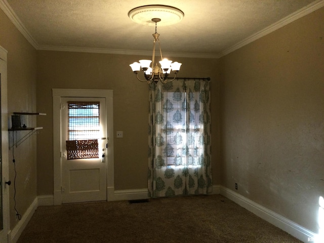 interior space with carpet flooring, ornamental molding, a textured ceiling, and an inviting chandelier