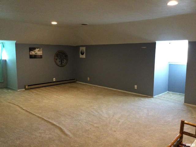 interior space featuring baseboard heating and light colored carpet