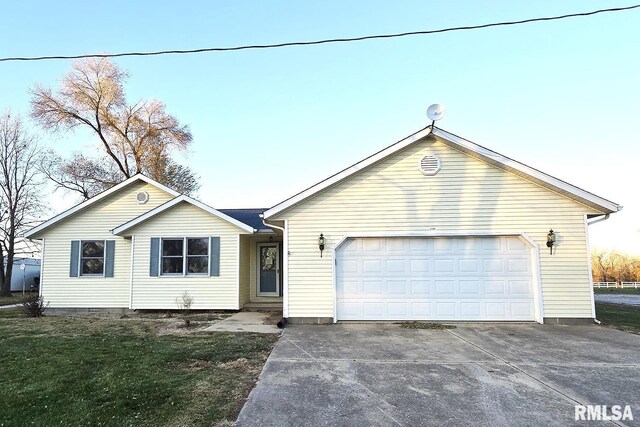 single story home featuring a garage