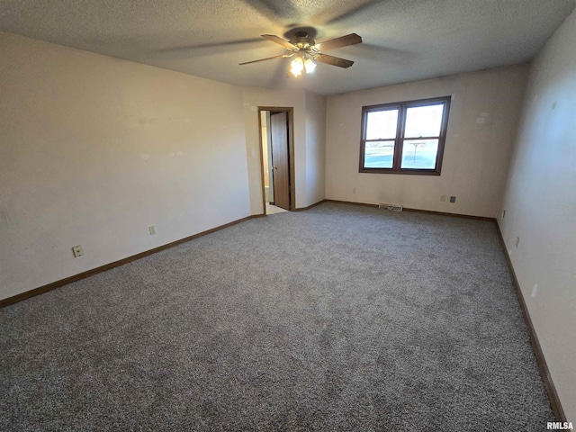 carpeted spare room featuring visible vents, baseboards, ceiling fan, and a textured ceiling