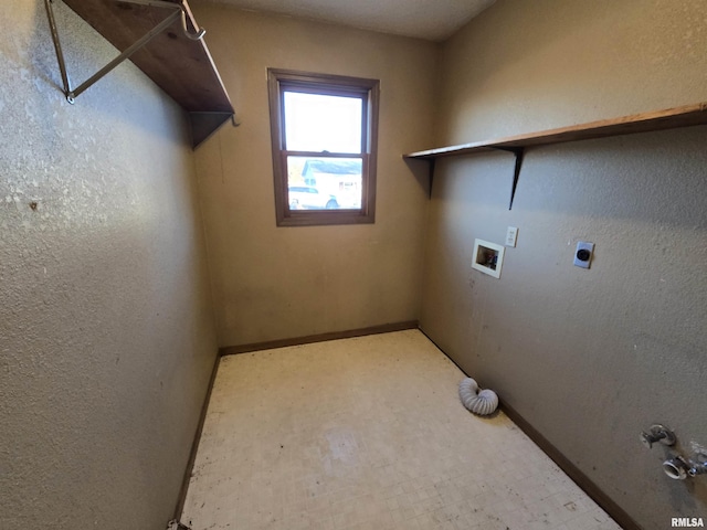 clothes washing area with laundry area, baseboards, tile patterned floors, hookup for a washing machine, and electric dryer hookup