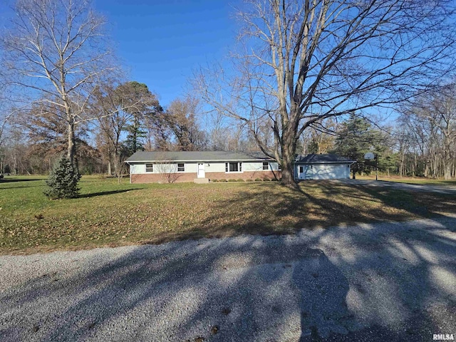 view of front facade with a front yard and a garage