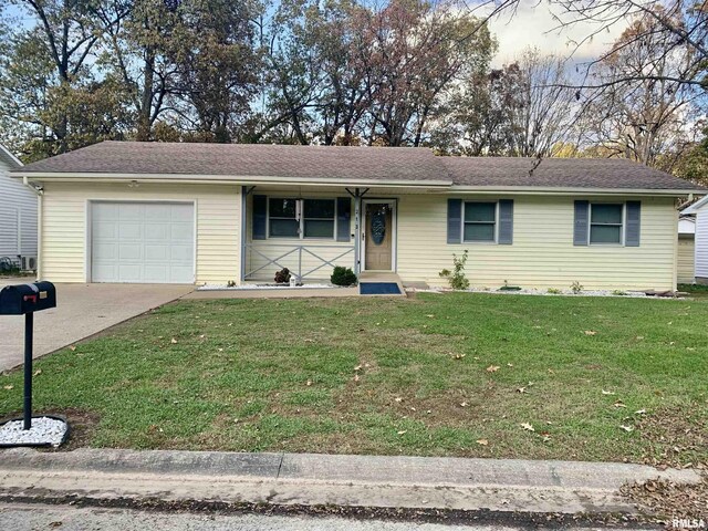 single story home with a front lawn and a garage