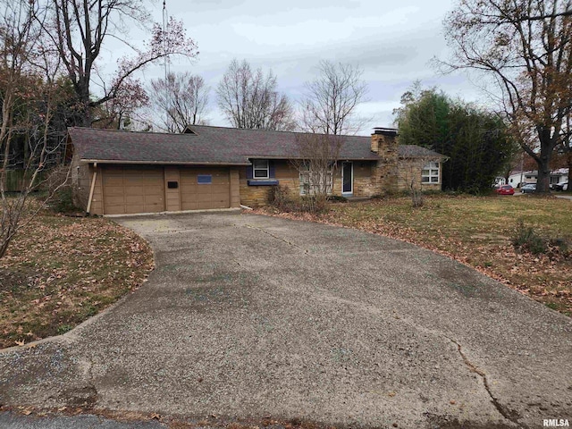 single story home with a garage