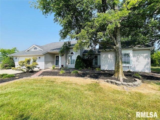 single story home featuring a front lawn