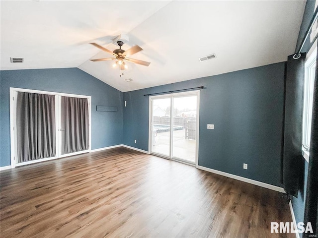 unfurnished room featuring ceiling fan, hardwood / wood-style floors, and lofted ceiling