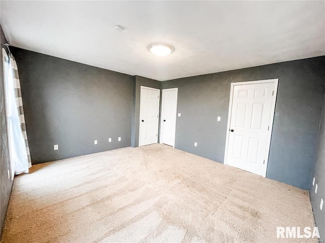 unfurnished bedroom featuring carpet