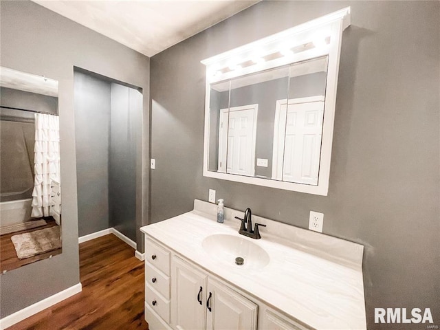 bathroom with vanity and wood-type flooring