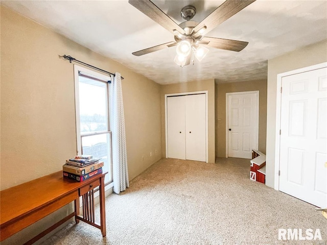 bedroom with carpet flooring, ceiling fan, and a closet