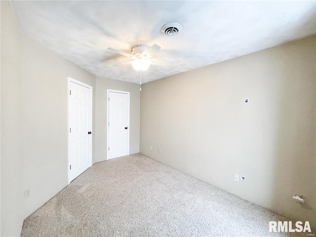 unfurnished room with carpet floors and ceiling fan