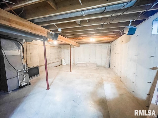 basement featuring heating unit