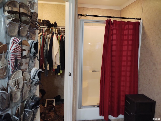 interior space featuring a shower and crown molding