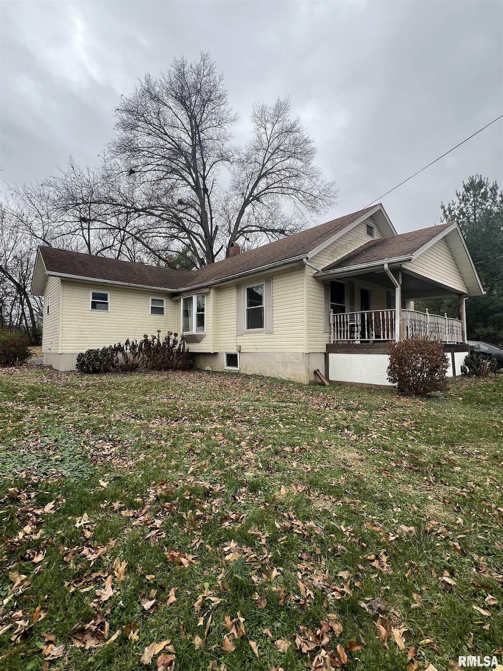 back of house with a yard