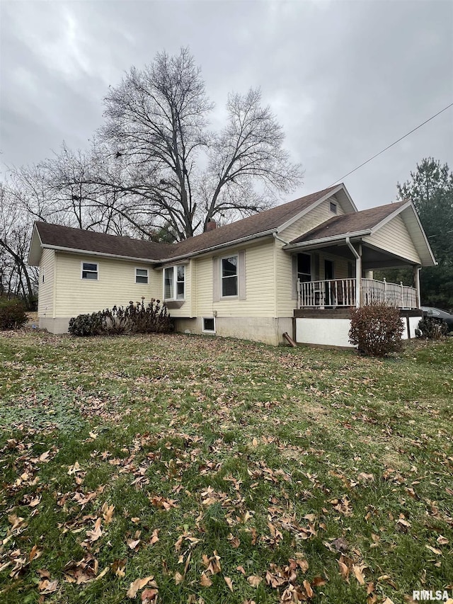 back of house with a yard