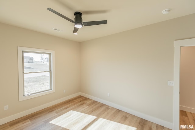 empty room featuring light hardwood / wood-style floors and ceiling fan