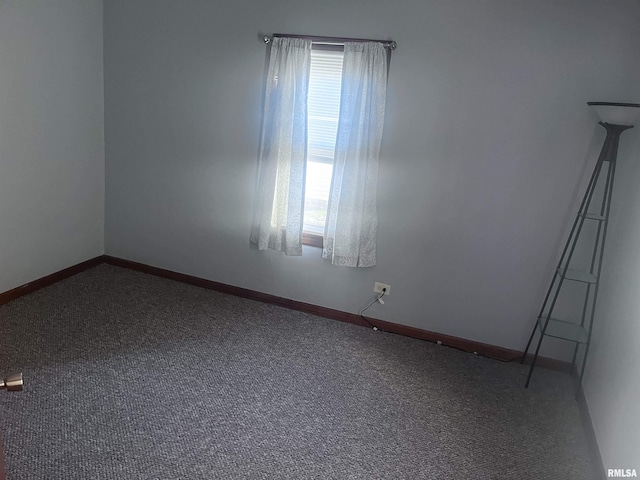 carpeted spare room featuring a healthy amount of sunlight