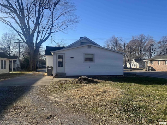 view of property exterior featuring a yard