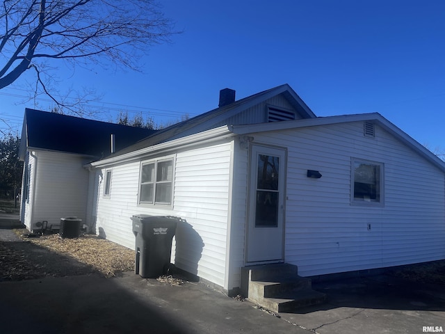 view of side of property featuring central AC unit