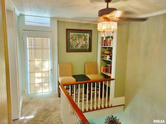 interior space featuring carpet flooring and crown molding