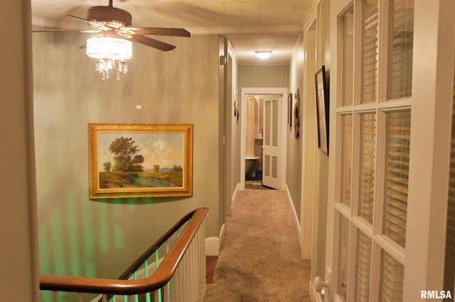 hall featuring light carpet and crown molding