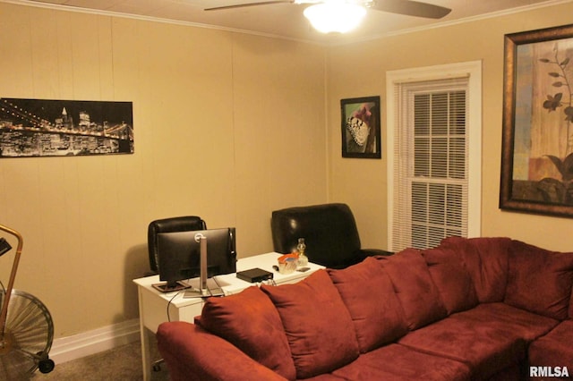 carpeted living room with ceiling fan and ornamental molding