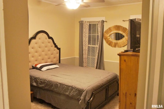 bedroom featuring carpet floors, crown molding, and ceiling fan