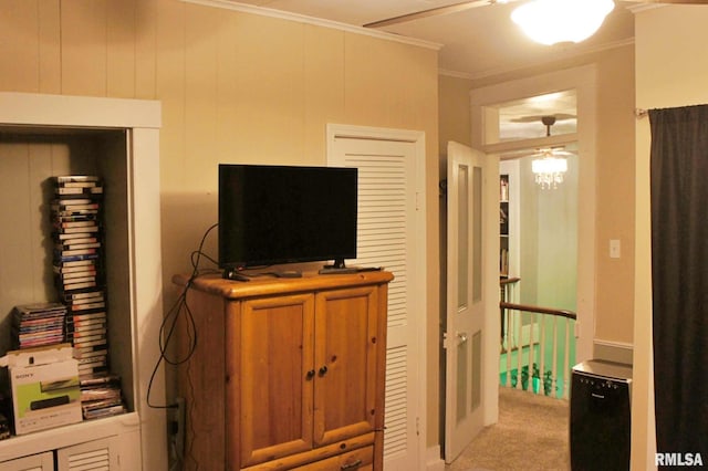 bedroom with light colored carpet and crown molding