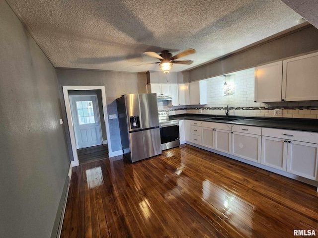 kitchen featuring dark hardwood / wood-style flooring, white cabinetry, and stainless steel appliances