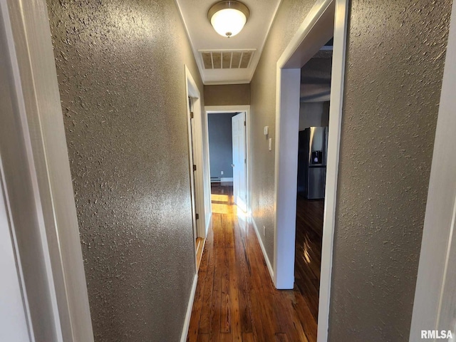 corridor featuring dark wood-type flooring