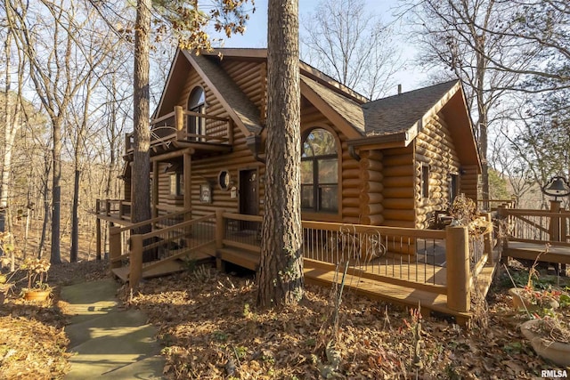 221 Poplar Lake Rd, Makanda, IL 62958 - view of front of property featuring log siding, a balcony, a shingled roof, and a deck