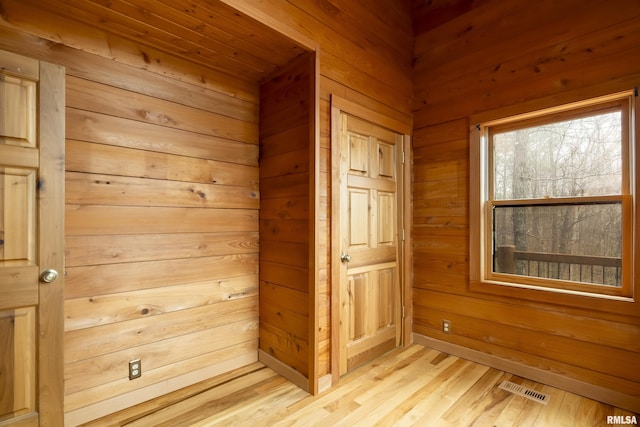 221 Poplar Lake Rd, Makanda, IL 62958 - empty room featuring wood walls, light wood-style floors, and a sauna / steam room