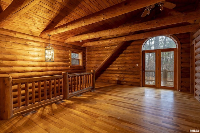 additional living space featuring beam ceiling, wood ceiling, hardwood / wood-style flooring, and ceiling fan