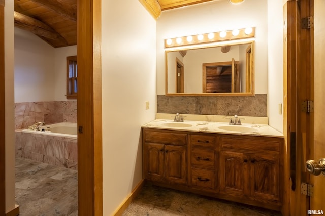 bathroom with vanity and tiled bath