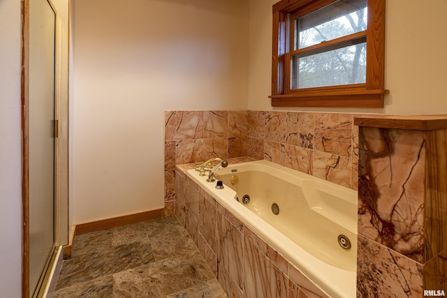 221 Poplar Lake Rd, Makanda, IL 62958 - full bathroom with baseboards, a whirlpool tub, a shower stall, and stone finish flooring