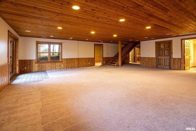 221 Poplar Lake Rd, Makanda, IL 62958 - basement with a wainscoted wall, wood walls, wood ceiling, stairs, and carpet flooring