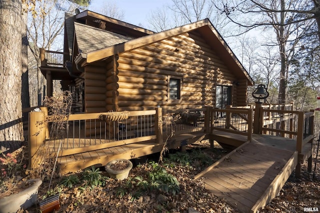 221 Poplar Lake Rd, Makanda, IL 62958 - view of side of property with log siding, a shingled roof, and a wooden deck