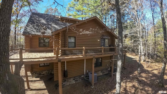 221 Poplar Lake Rd, Makanda, IL 62958 - rear view of property featuring log exterior, roof with shingles, a wooden deck, and cooling unit