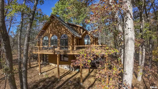 back of house featuring a deck