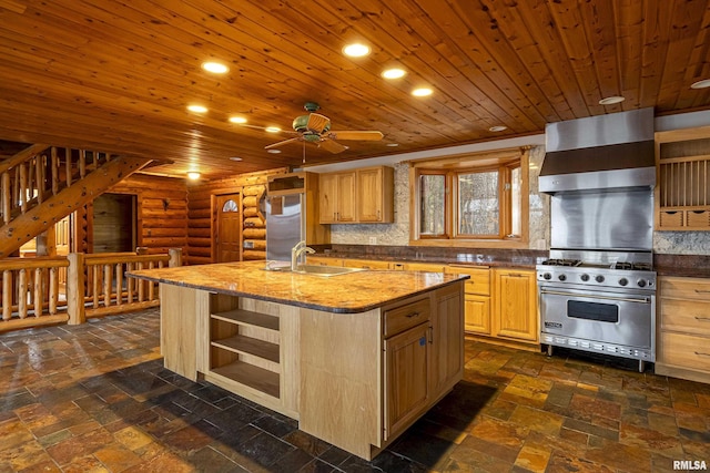 kitchen featuring sink, wood ceiling, appliances with stainless steel finishes, a kitchen island with sink, and wall chimney exhaust hood