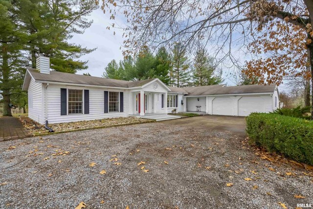 ranch-style home featuring a garage