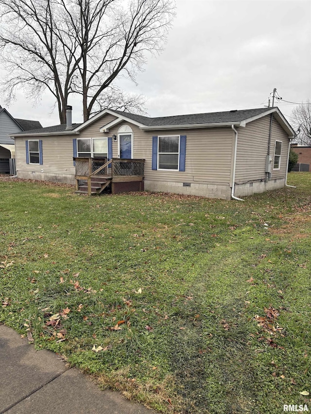 view of front of property featuring a front yard and a wooden deck