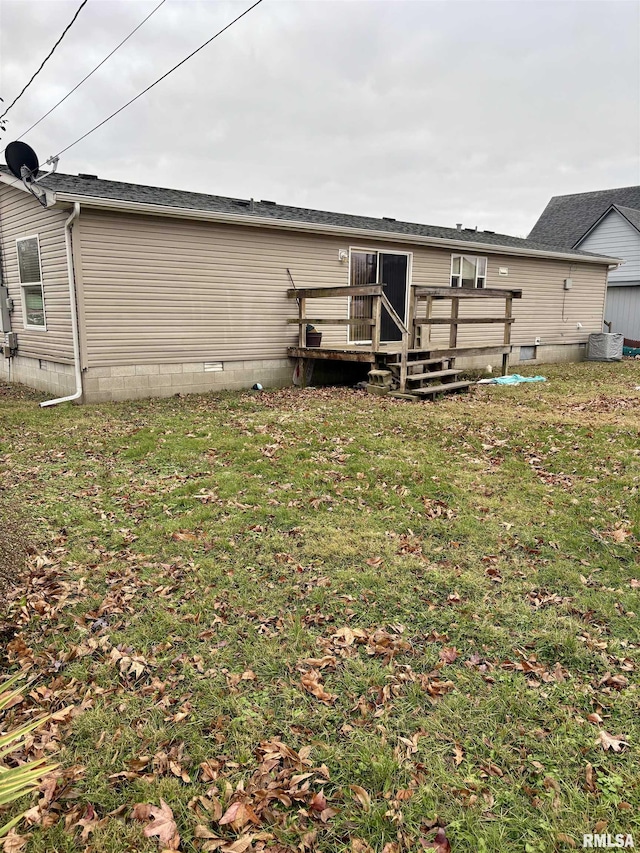 back of house with a wooden deck, a yard, and cooling unit