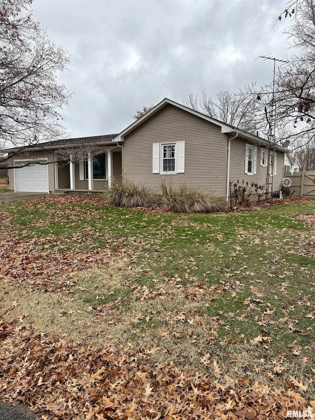 ranch-style house with a front lawn and a garage