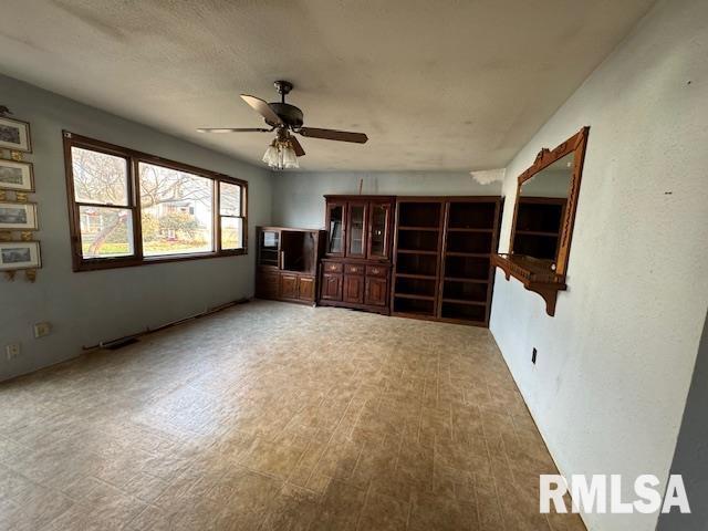 interior space featuring ceiling fan and wood-type flooring