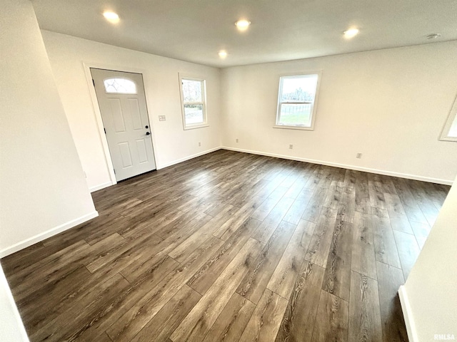 entrance foyer with dark hardwood / wood-style floors