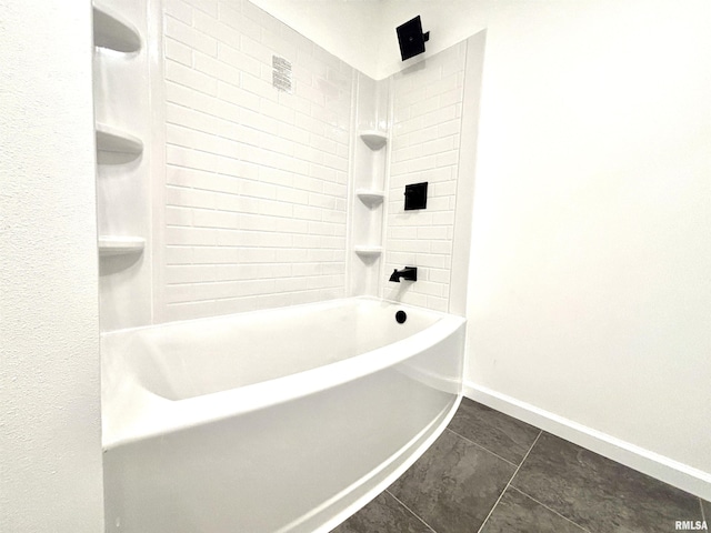 bathroom featuring tile patterned flooring and tiled shower / bath combo