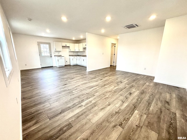 unfurnished living room with hardwood / wood-style flooring